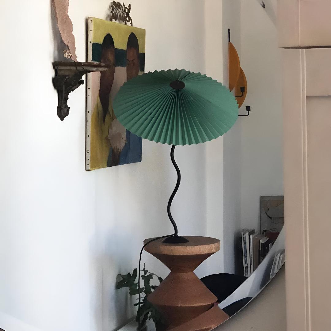 Bedside Table Lamp With Pleated Shade And Squiggled Curved Stem